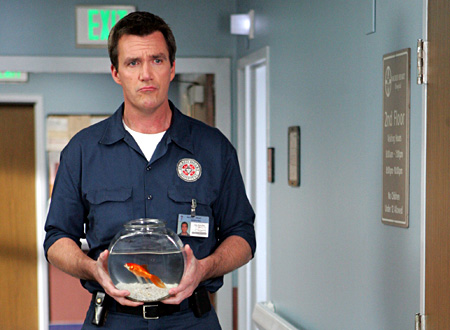 Janitor Holds a Goldfish