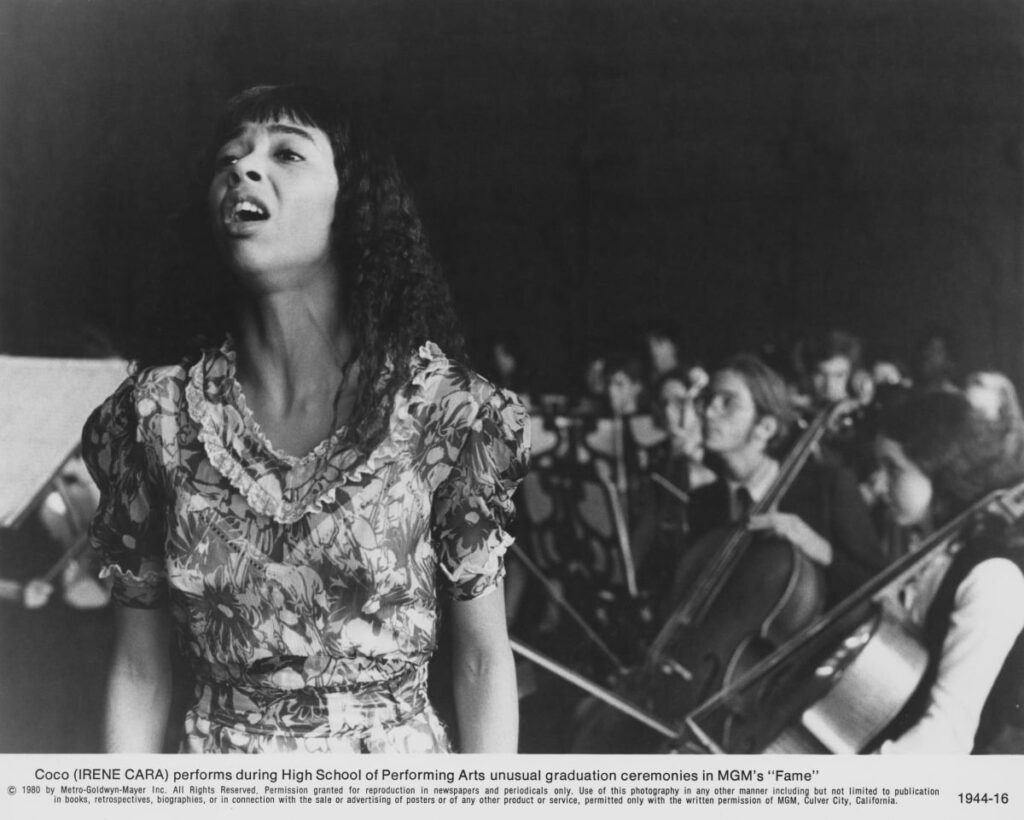 Coco Hernandez (Irene Cara) performs at a graduation ceremony in a scene from 'Fame', directed by Alan Parker, 1980.