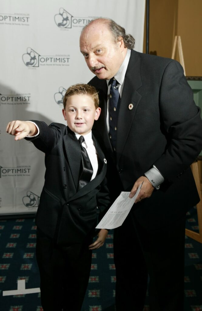 Actors Austin Majors and Dennis Franz look into the audience at The 7th Annual Mentor Awards Gala