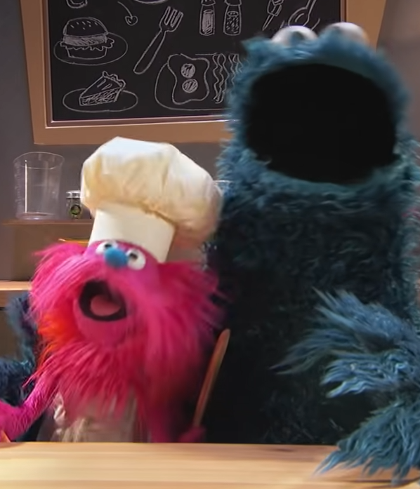 Cookie Monster and Chef Gongo in their food truck.