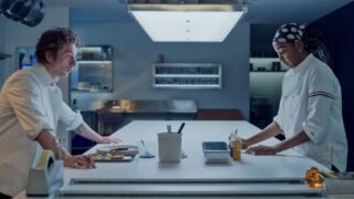 Carmy (Jeremy Allen White) and Sydney (Ayo Edebiri) in the kitchen on The Bear 