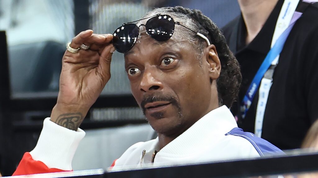     Snoop Dogg (right) competes during the women's qualifying event for artistic gymnastics on day two of the 2024 Paris Olympic Games at the Stade Bercy on July 28, 2024 in Paris, France.