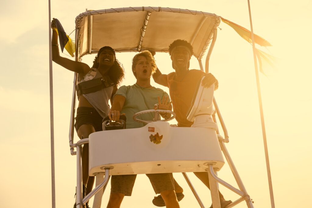 Carlacia Grant as Cleo, Rudy Pankow as JJ, Jonathan Daviss as Pope in Outer Banks Season 4 Episode 1.