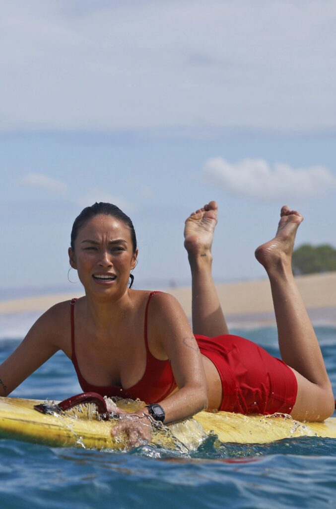 Hina paddles out for a rescue during Rescue HI-Surf Season 1 Episode 1.