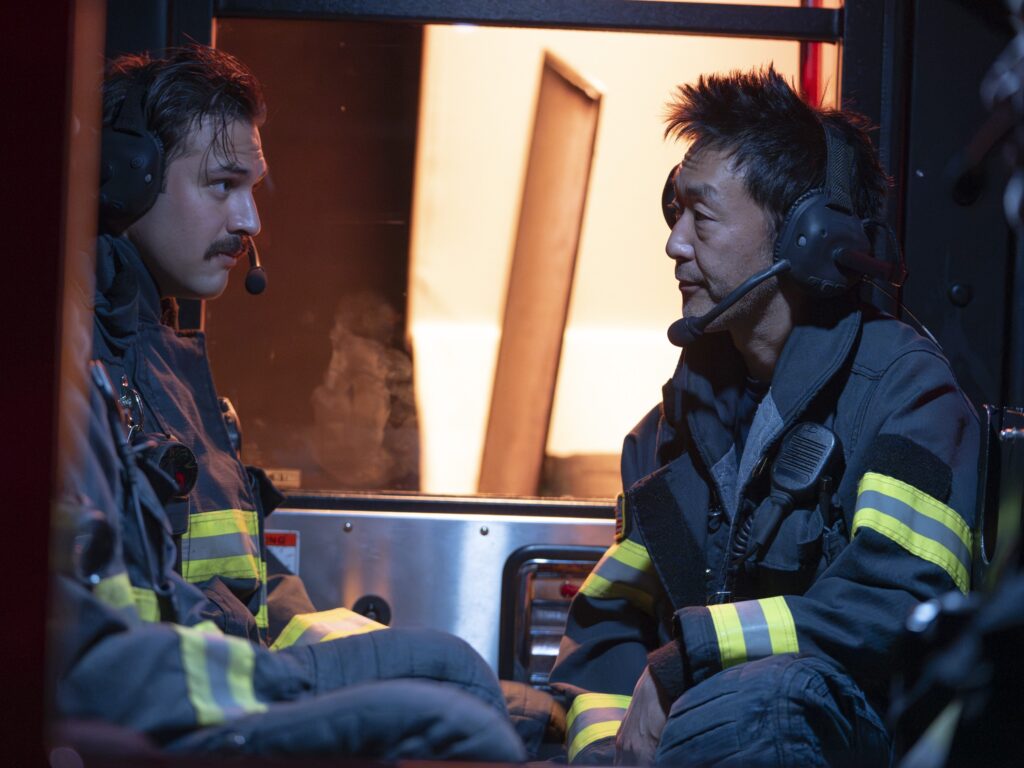 Eddie and Chimney are strapped in the fire truck during 9-1-1 Season 8 Episode 3.