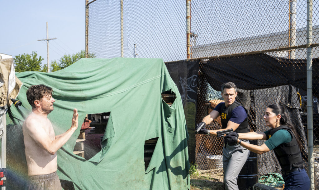 FBI agents at a homeless camp