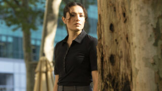 Kate standing by some trees outside on Law & Order: SVU Season 26 Episode 5