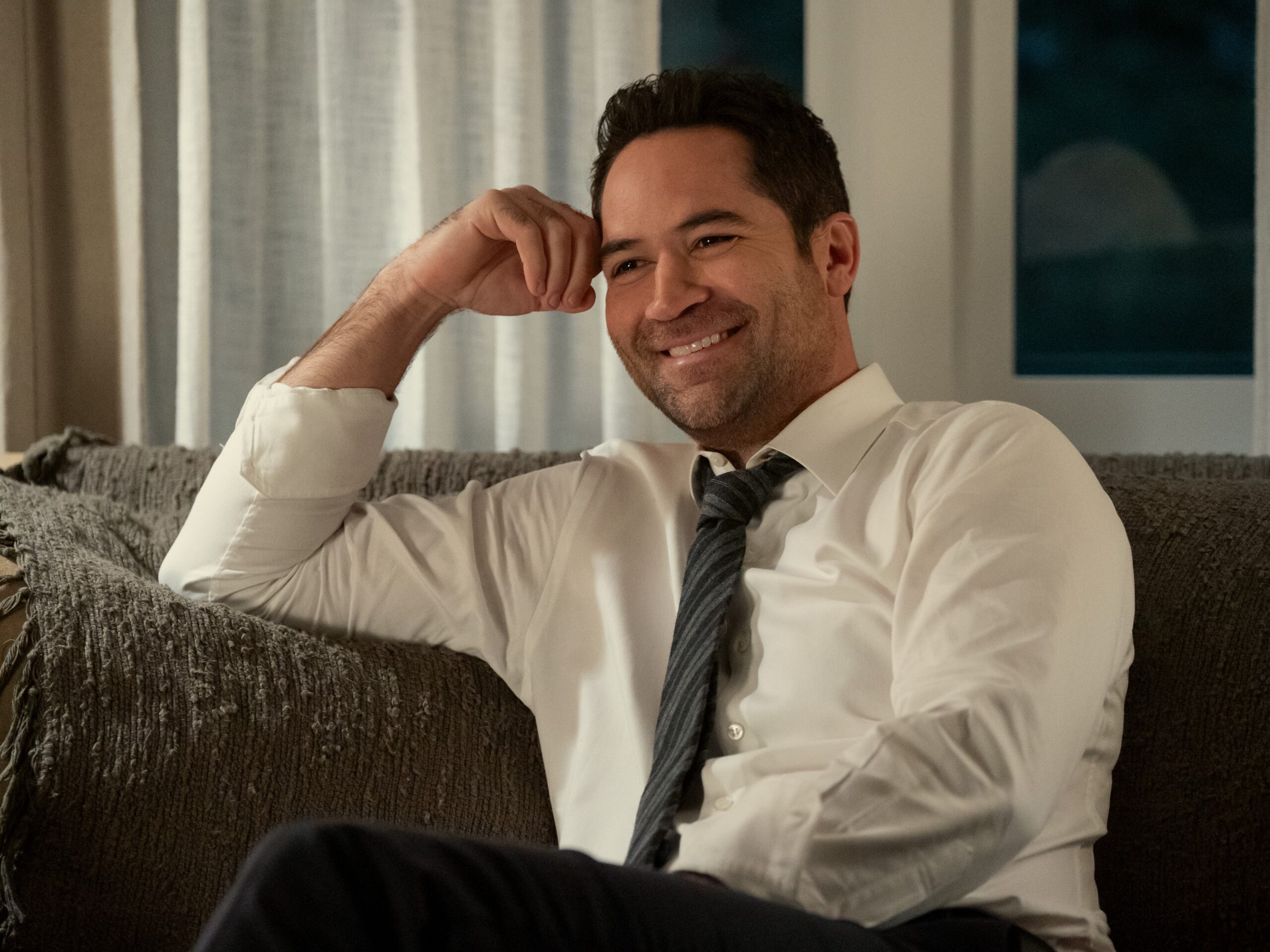 Mickey is all smiles during The Lincoln Lawyer Season 3.