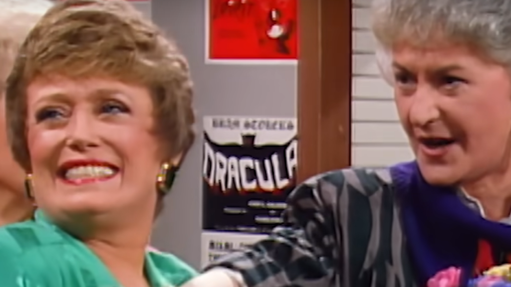 A smiling Blanche & Dorothy wear colorful tops