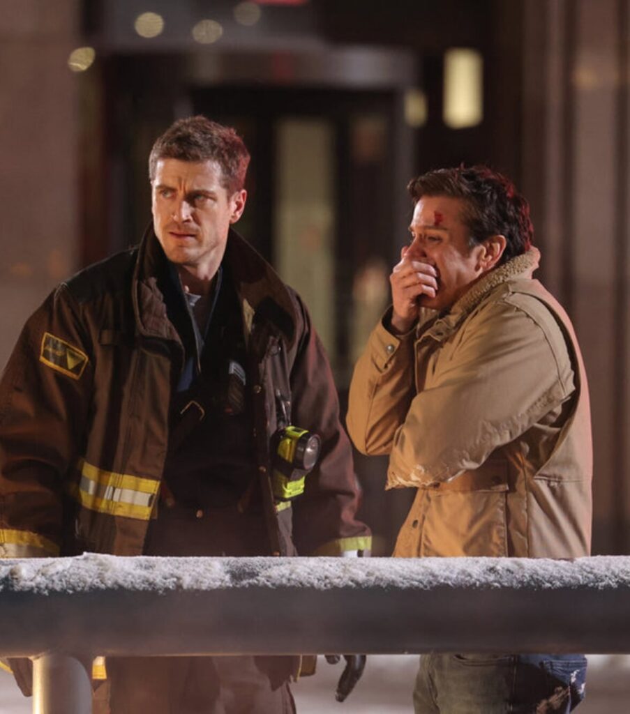 Carver and a crying man at a fire scene