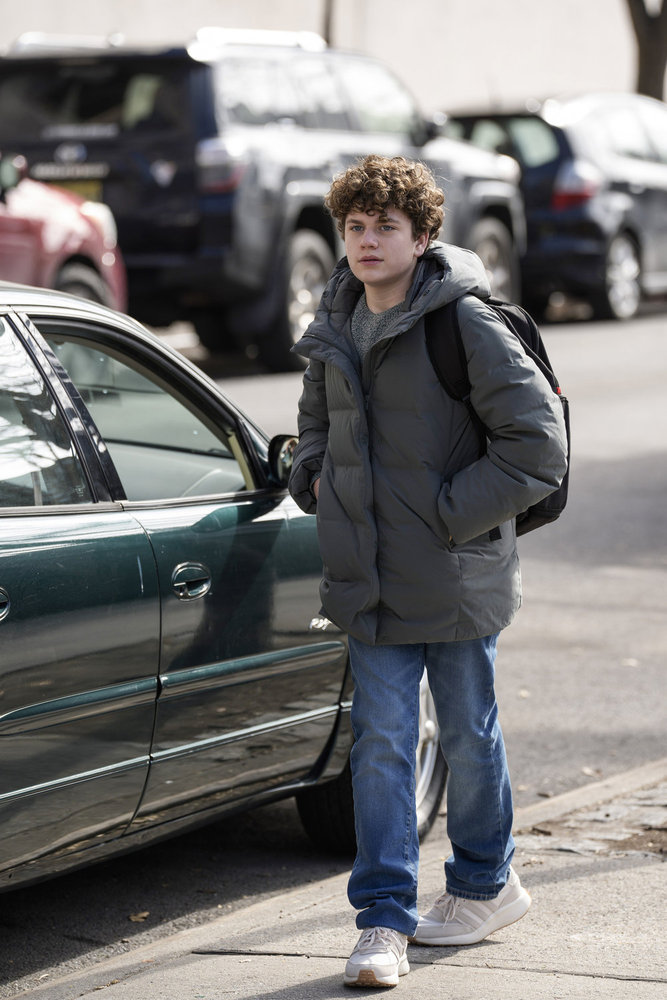 Noah walking by a car on Law & Order: SVU Season 26 Episode 19