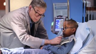 Dr. Charles examines a little boy on Chicago Med Season 10 Episode 20