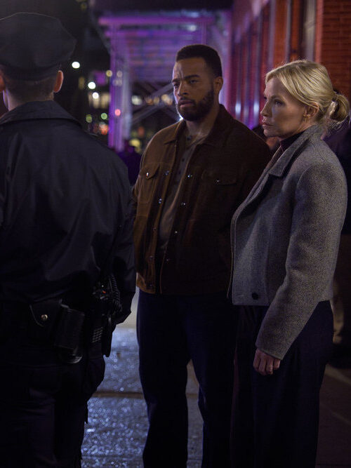 Benson and Fin meet on a dark street with Intelligence officers on Law & Order: SVU Season 26 Episode 3