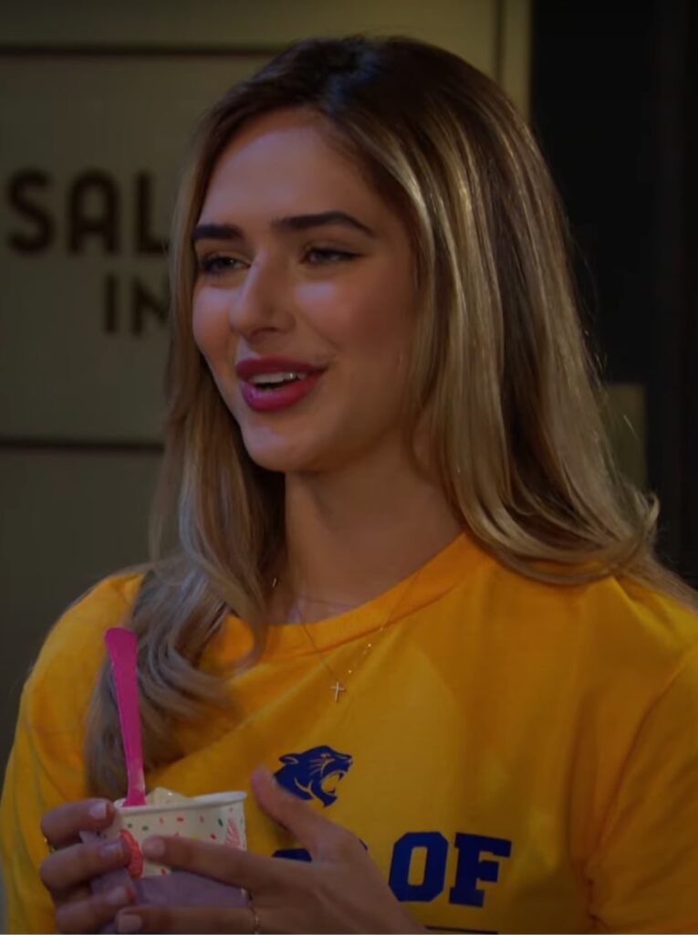 Holly holding a cup of frozen yogurt and smiling on Days of Our Lives during the week of 6-16-25