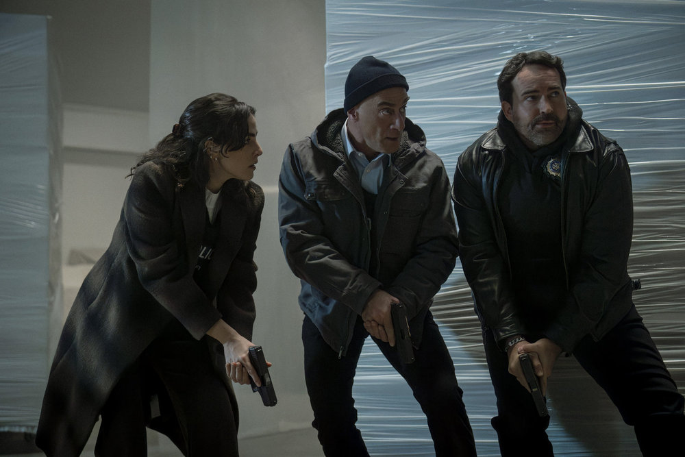 Stabler, Tanner, and McKenna repond to a false tip with guns drawn on Law & Order: Organized Crime Season 5 Episode 9
