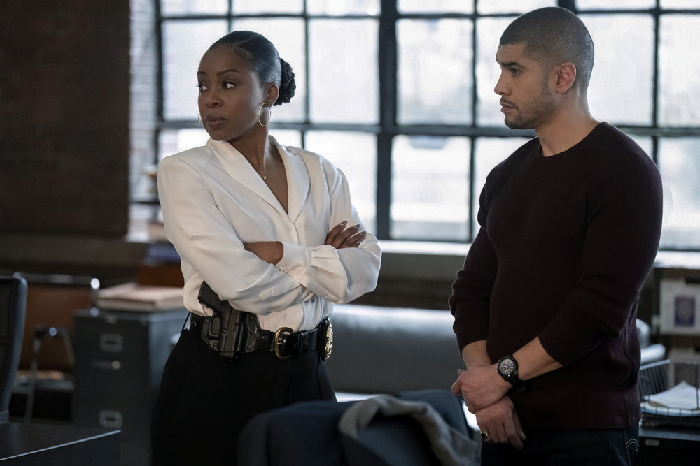 Bell looking over her shoulder and seeming annoyed while talking to Reyes on Law & Order: Organized Crime Season 5 Episode 10