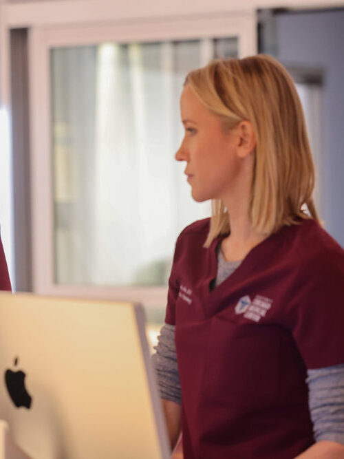 Mitch and Hannah stare at each other on Chicago Med Season 10 Episode 22
