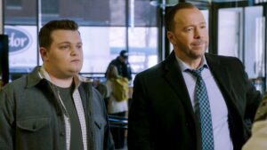 Danny and Sean standing side by side on Blue Bloods