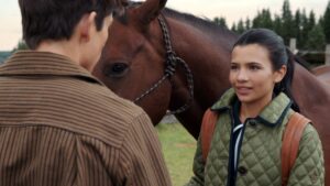 Jackie and Alex standing by a horse on My Life With the Walter Boys Season 2