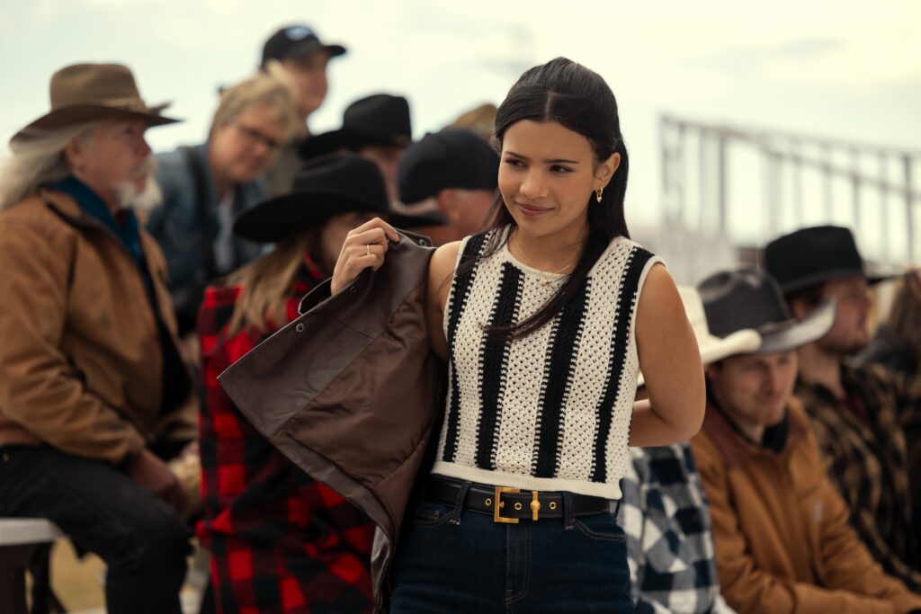 Jackie taking off a jacket at a competition on My Life With The Walter Boys Season 2