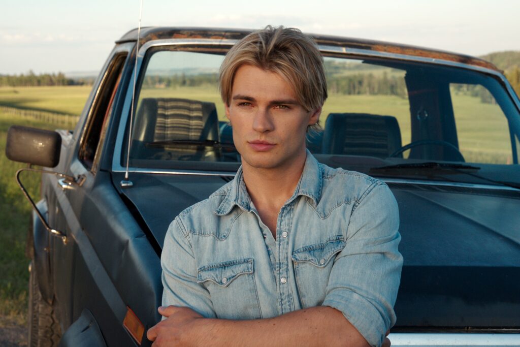 Cole standing in front of a car on My LIfe With The Walter Boys Season 2