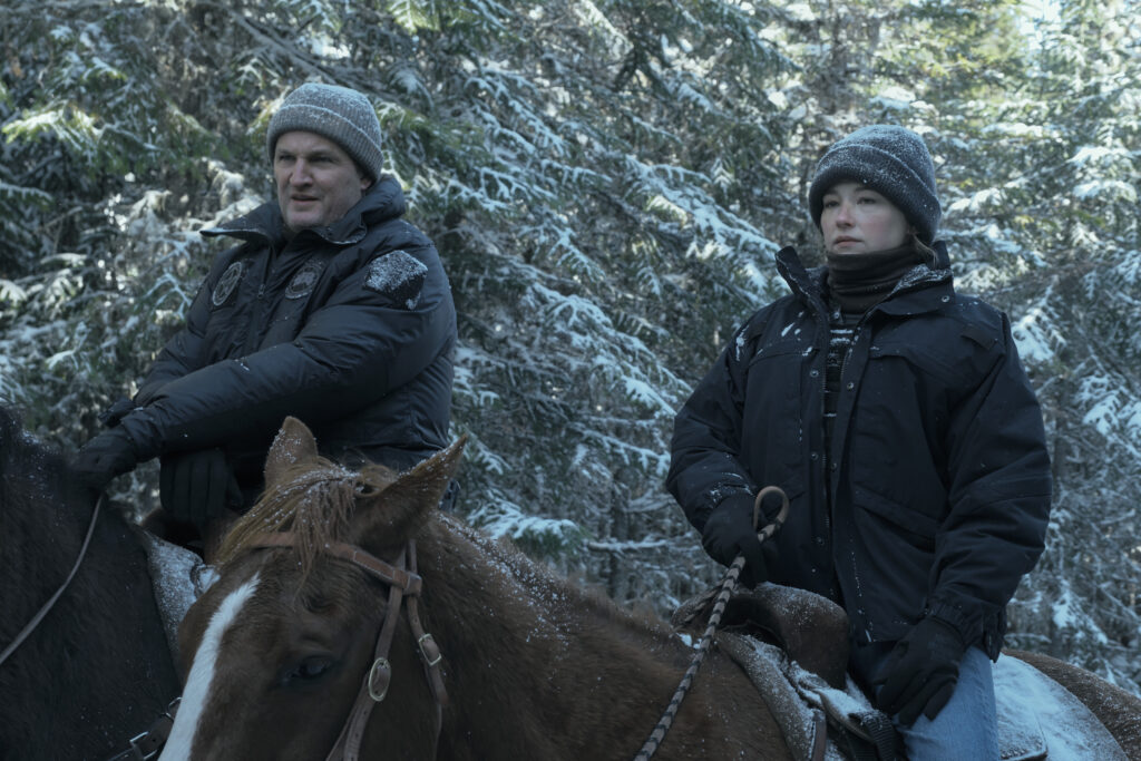 A marshal and companion on horseback