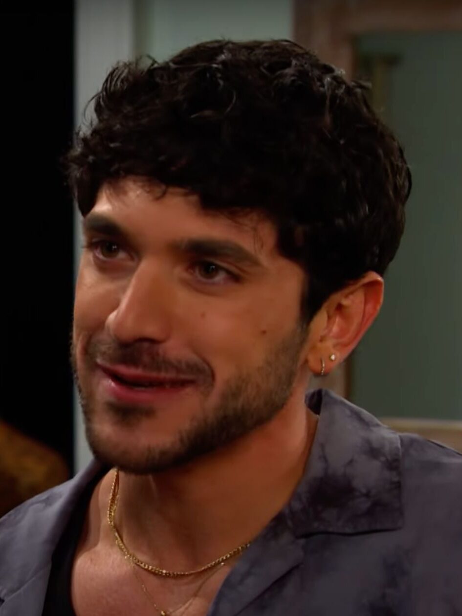 Javi grins while listening to Gabi on Days of Our Lives during the week of 8-25-25