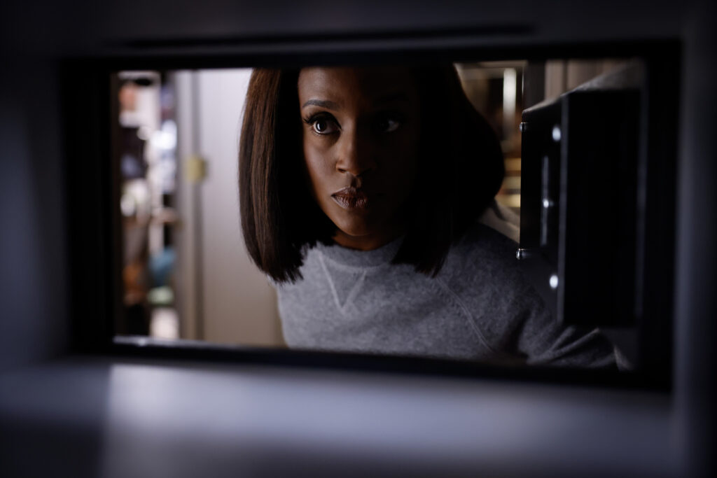 Olympia looks in an empty safe on Matlock Season 2 Episode 1