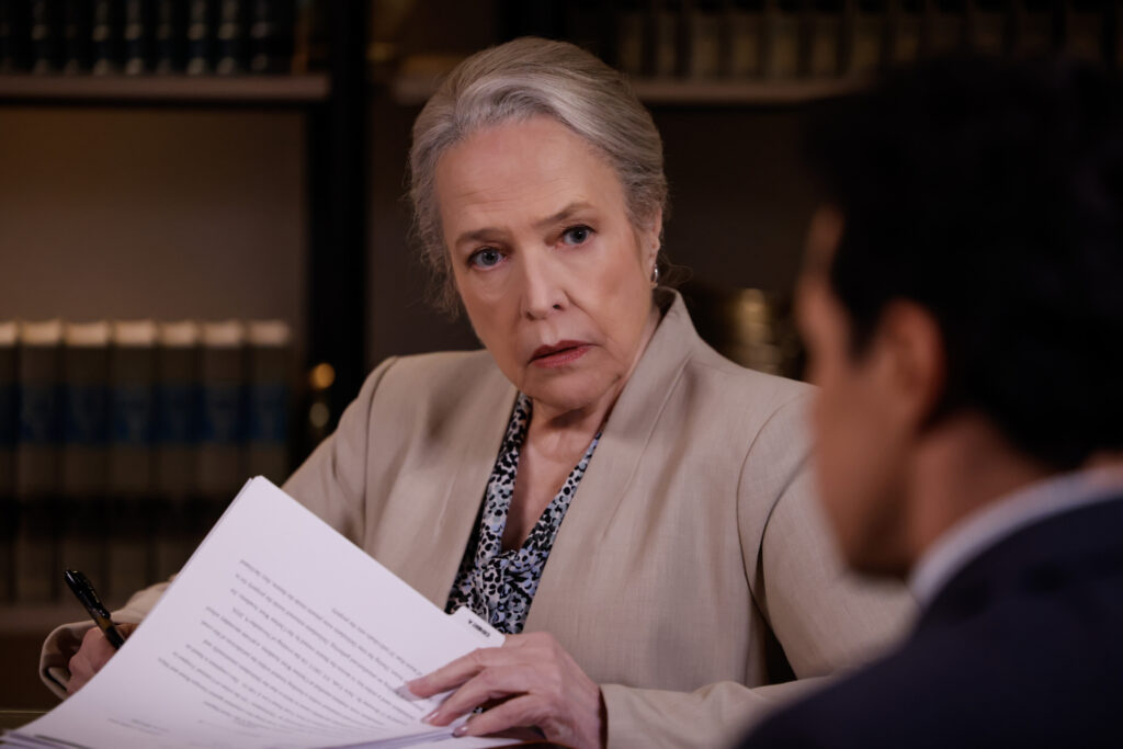 Madeline stares while checking out a document on Matlock Season 2 Episode !