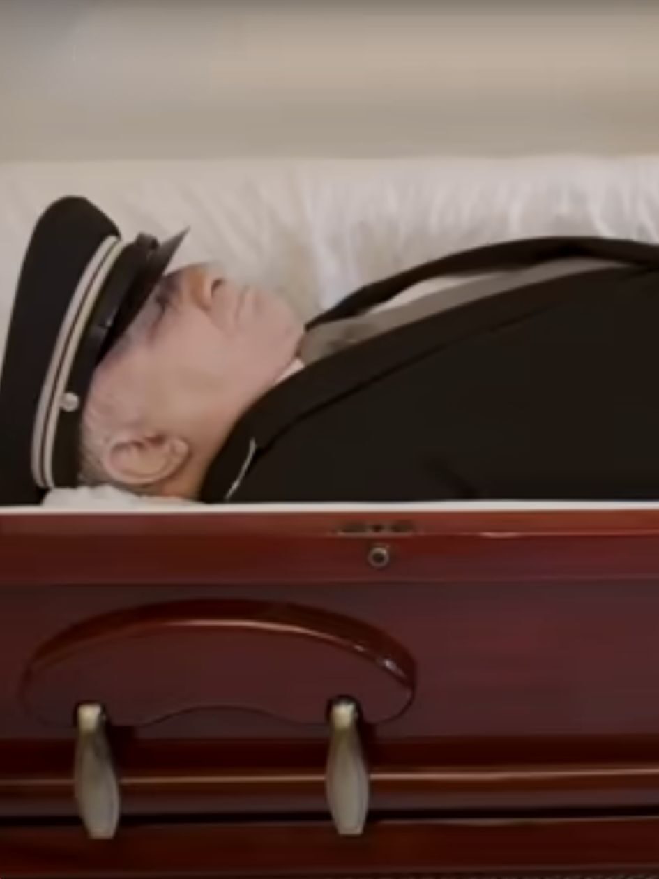 Lester lying in his coffin at his funeral on Only Murders In The Building Season 5