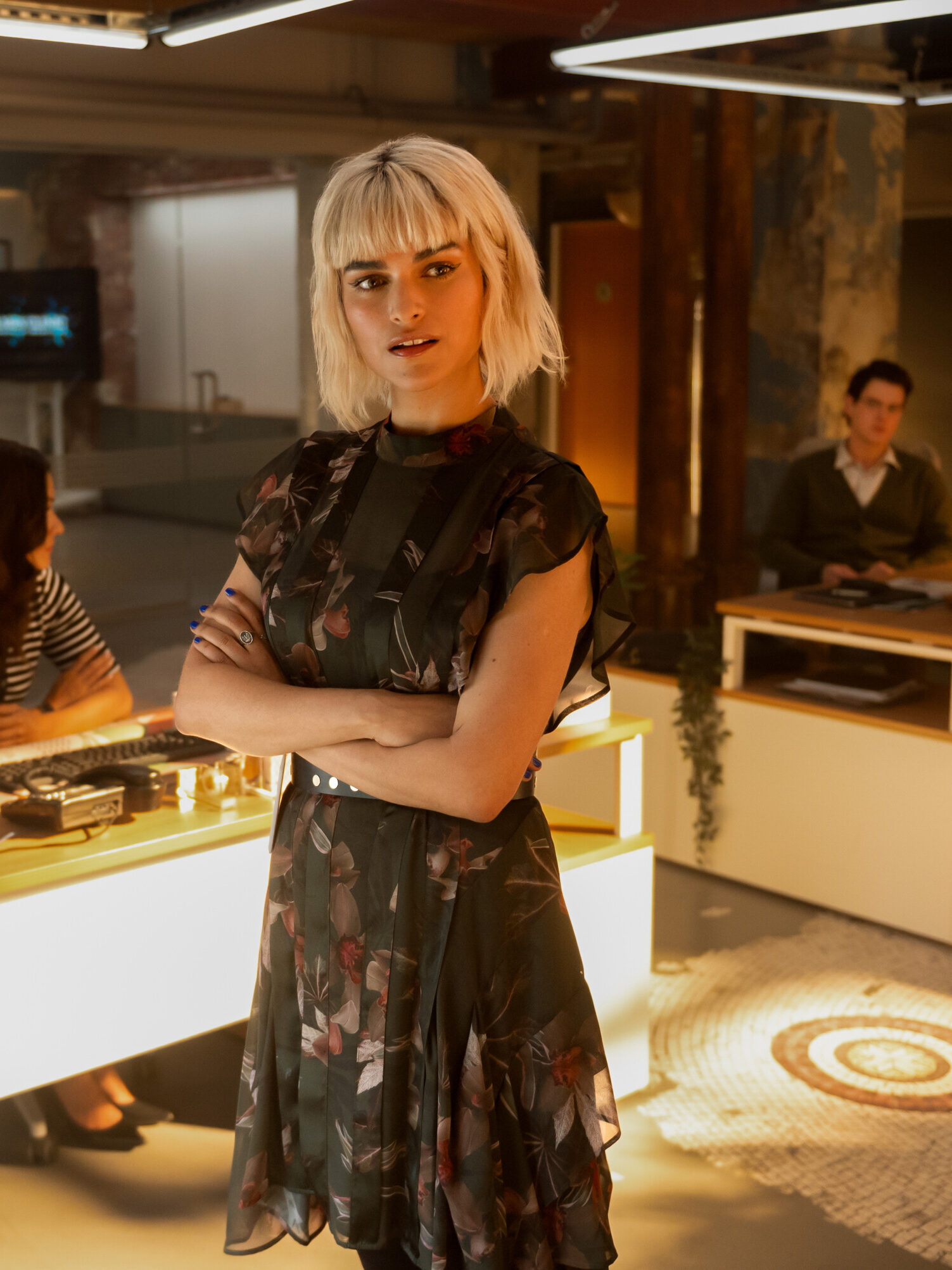 Ingrid stands in the lab with her arms crossed on Watson Season 2 Episode 3