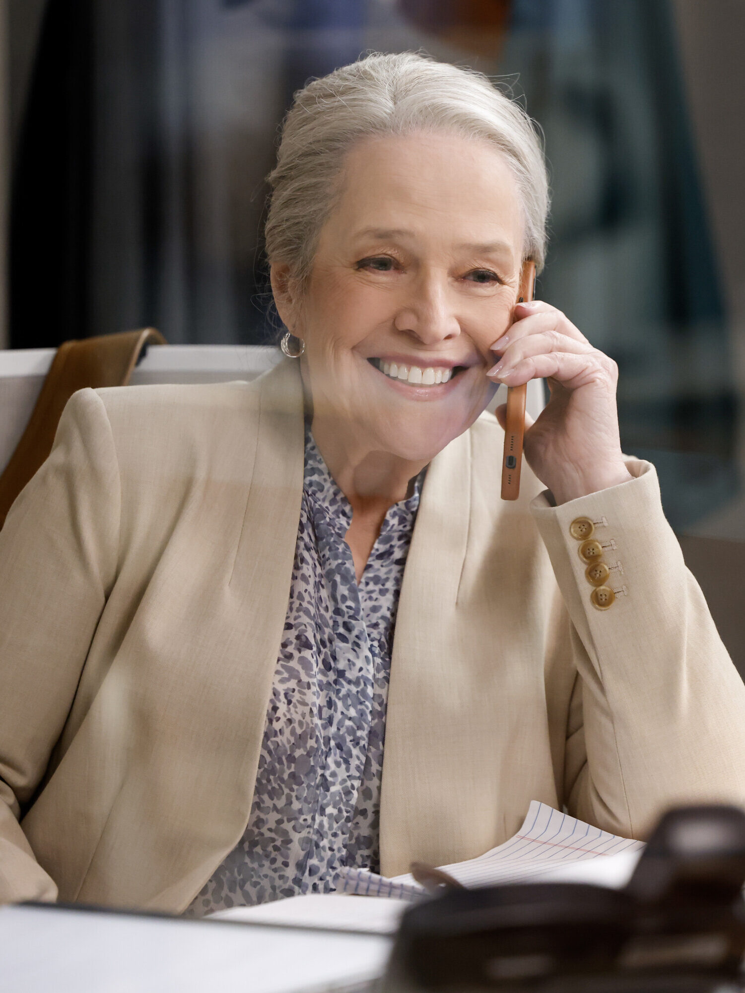 Matty smiling while talking on the phone on Matlock Season 2 Episode 4