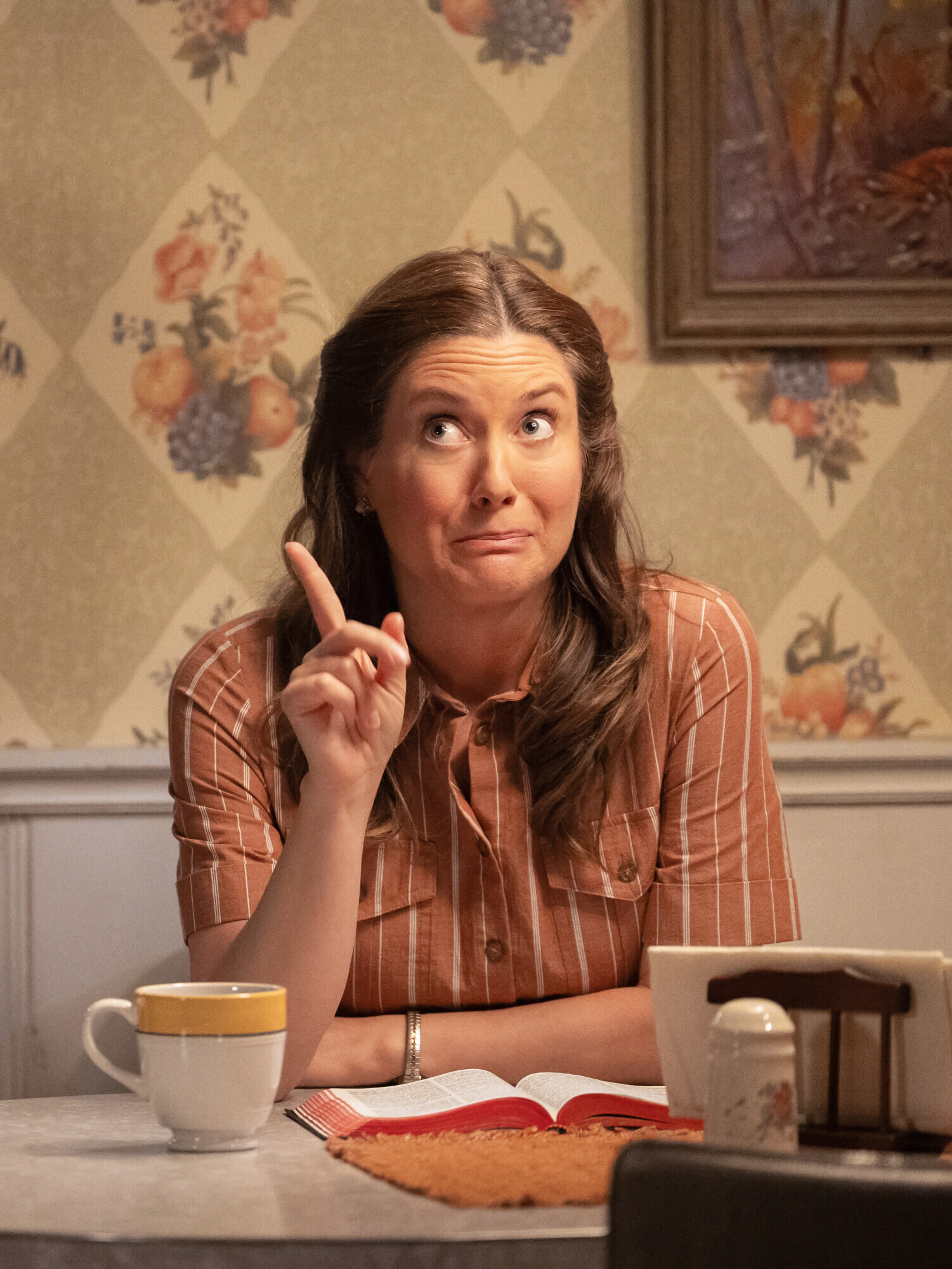 Mary sitting at the table making a point on Georgie & Mandy's First Marriage Season 2 Episode 3