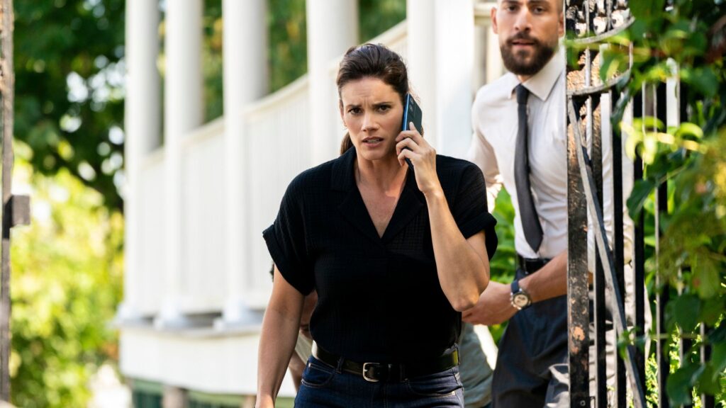 Maggie on the phone with OA behind her on FBI Season 8 Episode 1
