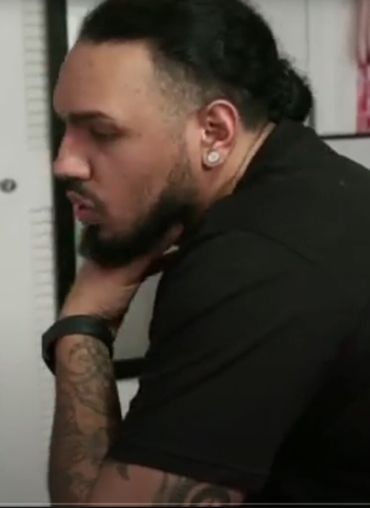 Michael sitting and thinking during an argument on Life After Lockup