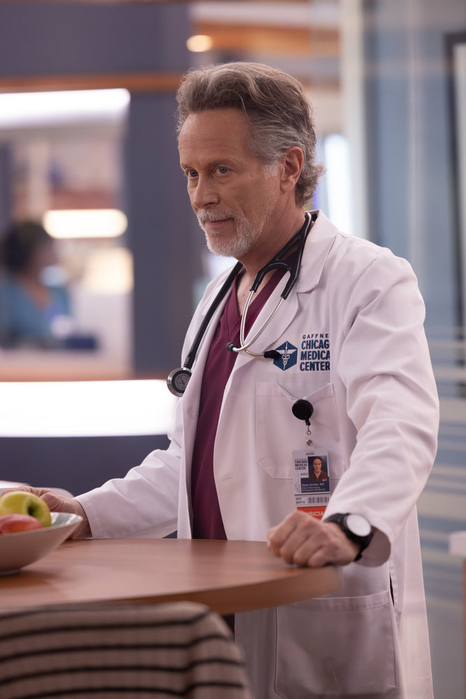 Archer standing and looking annoyed on Chicago Med Season 11 Episode 3