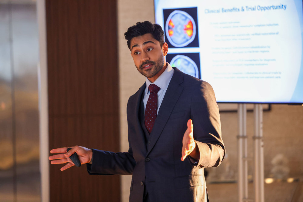 Dr. Theo Rabari makes a presentation to Dr. Charles on Chicago Med Season 11 Episode 4
