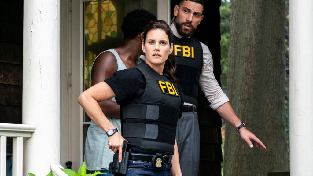 OA and Maggie standng together with FBI jackets on and guns accessible on FBI Season 8 Episode 1