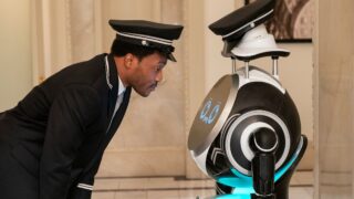 Randall gets on eye level with the robot on Only Murders In The Building Season 5 Episode 9