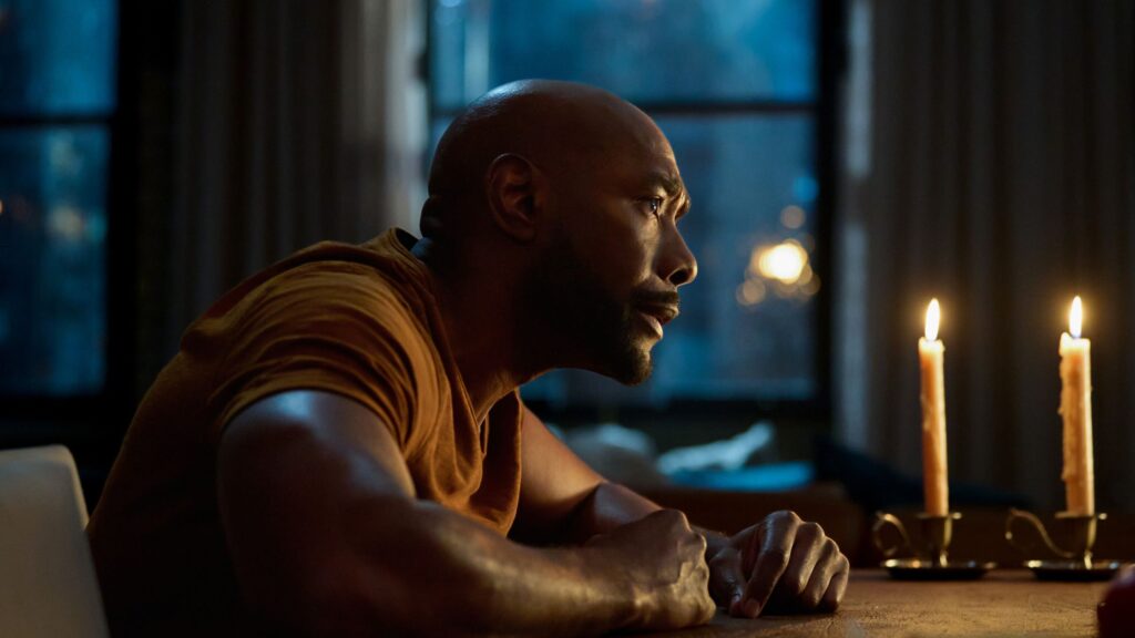 Watson leaning over and staring intensely on Watson Season 2 Episode 2
