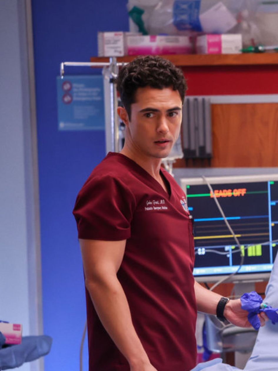 Will and Frost tanding on opposite sides of an empty bed on Chicago Med Season 11 Episode 2