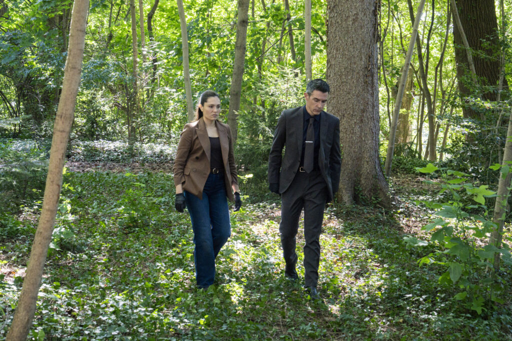 Scola and Ramos walk through the woods on FBI Season 8 Episode 4