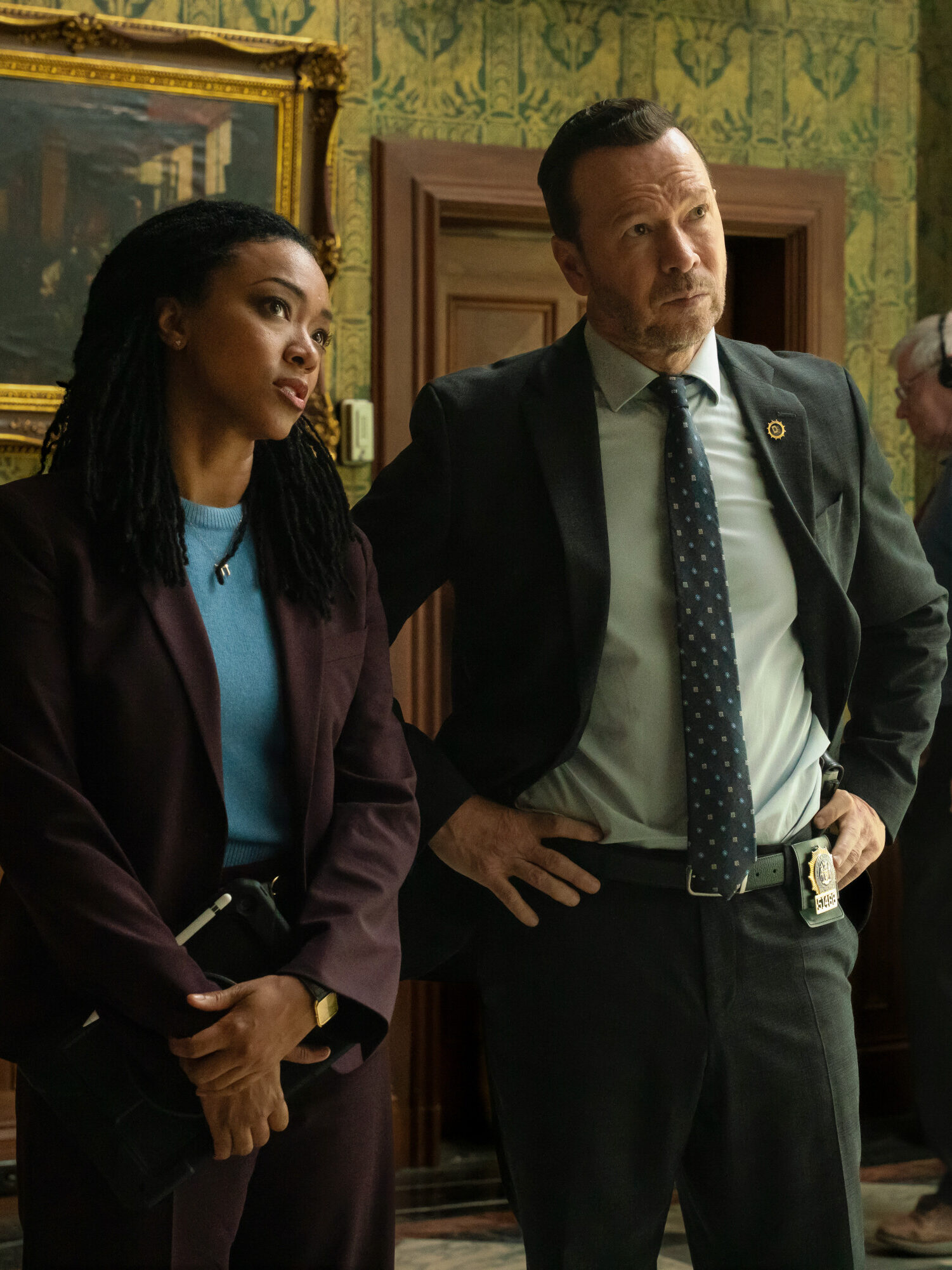 Danny and Lena look suspiciously at something off-screen on Boston Blue Season 1 Episode 5