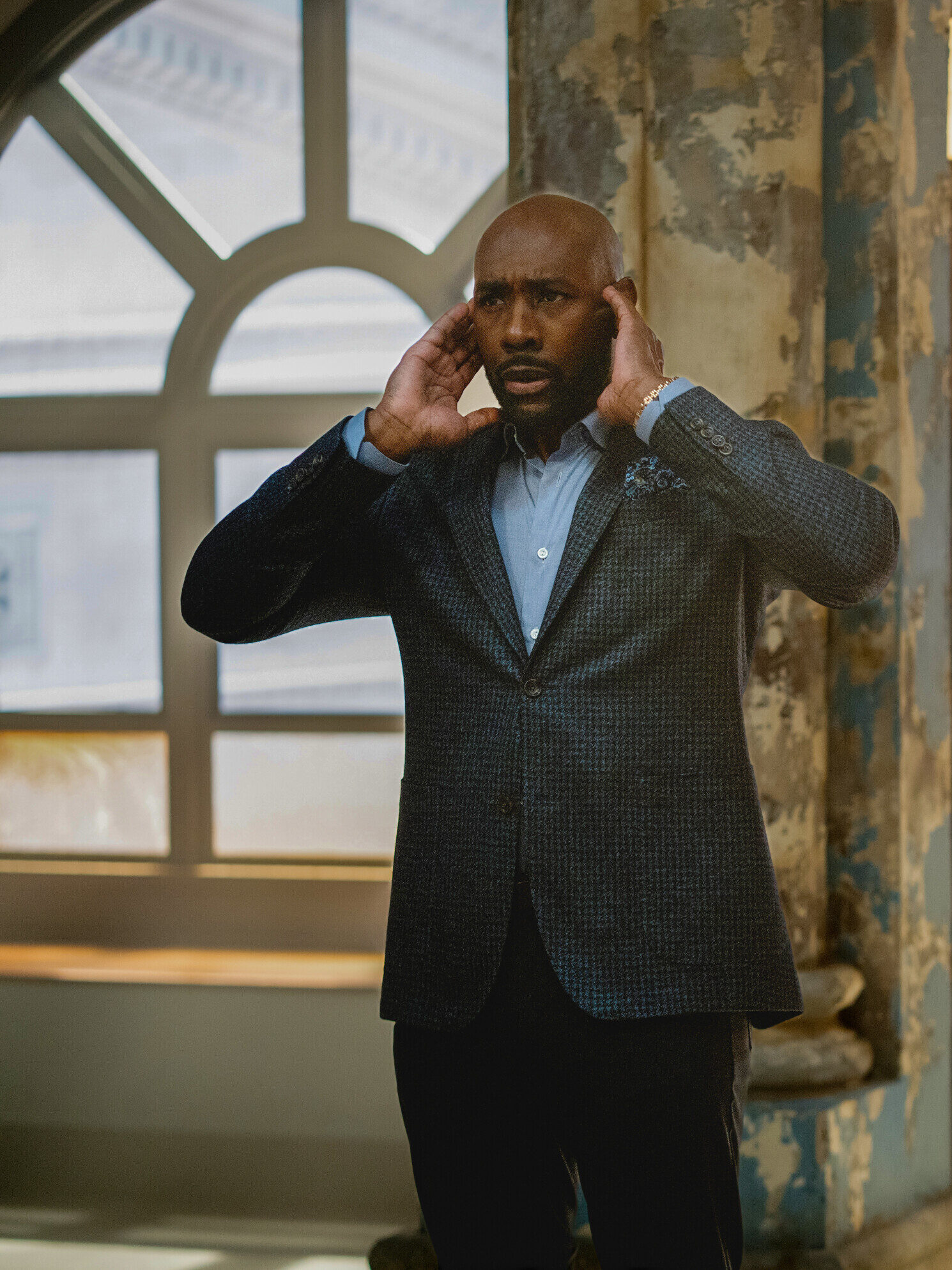 Watson and Adam put their hands over their ears after an explosion on Watson Season 2 Episode 8