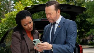 Danny and Lena check out evidence on a phone on Boston Blue Season 1 Episode 5