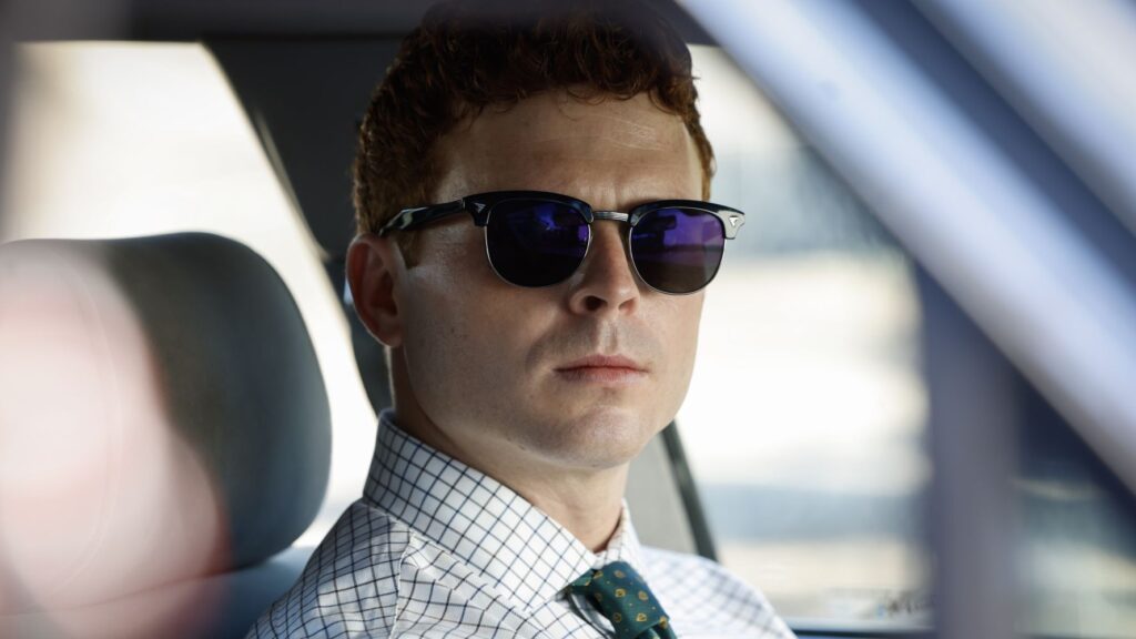 Caleb Foote as Randy in NCIS Origins wearing shades