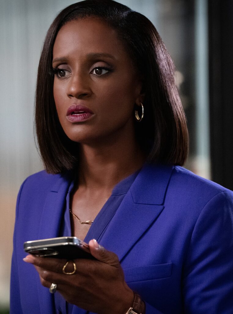 Olympia looks upset while on the phone on Matlock Season 2 Episode 8