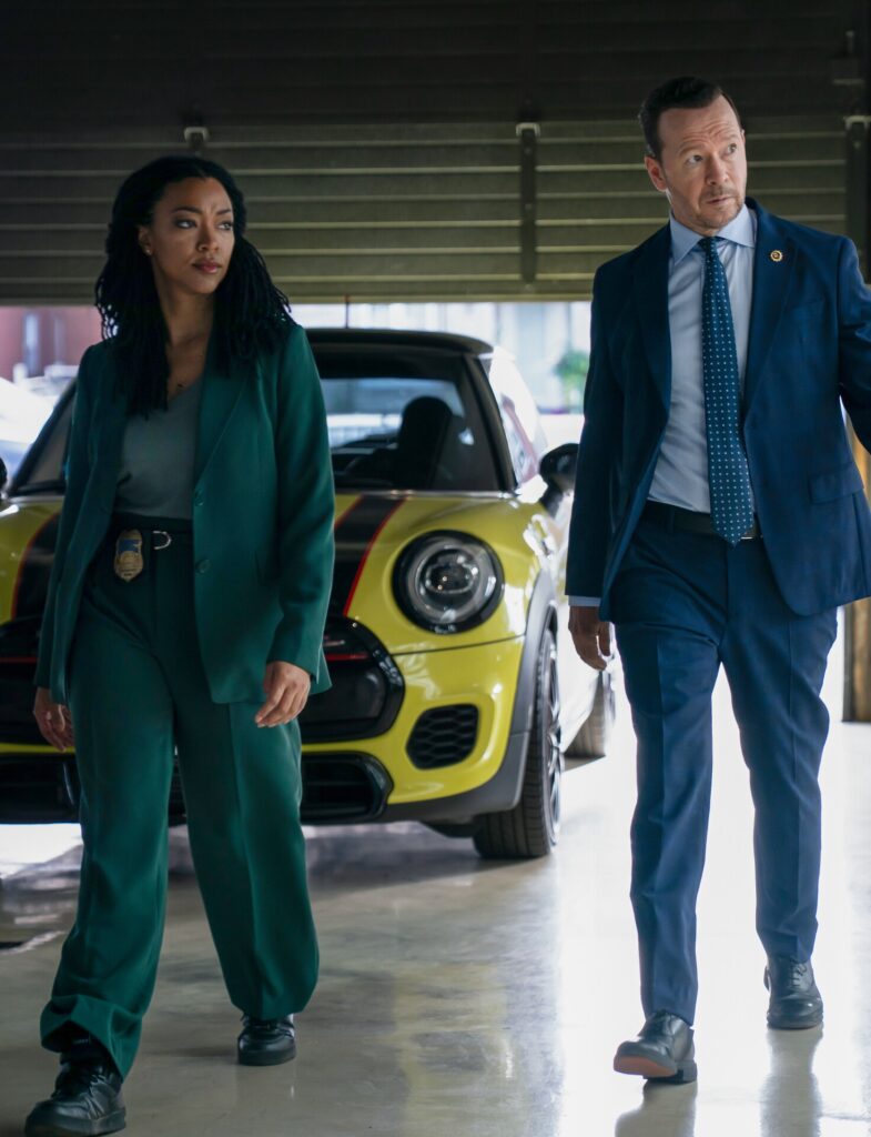 Danny and Lena walk through a parking lot on Boston Blue Season 1 Episode 8