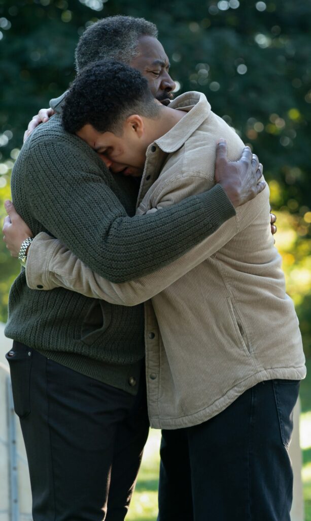 Edwin comforts Jonah at the graveyard on Boston Blue Season 1 Episode 9
