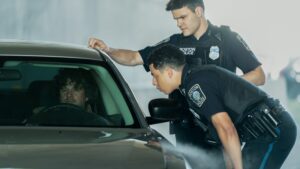 Jonah and Sean check on th durnk driver who crashed in front of them on Boston Blue Season 2 Episode 8